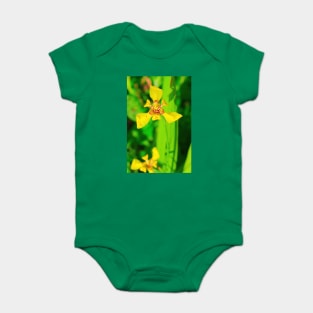 Yellow lily blossom on green background Baby Bodysuit